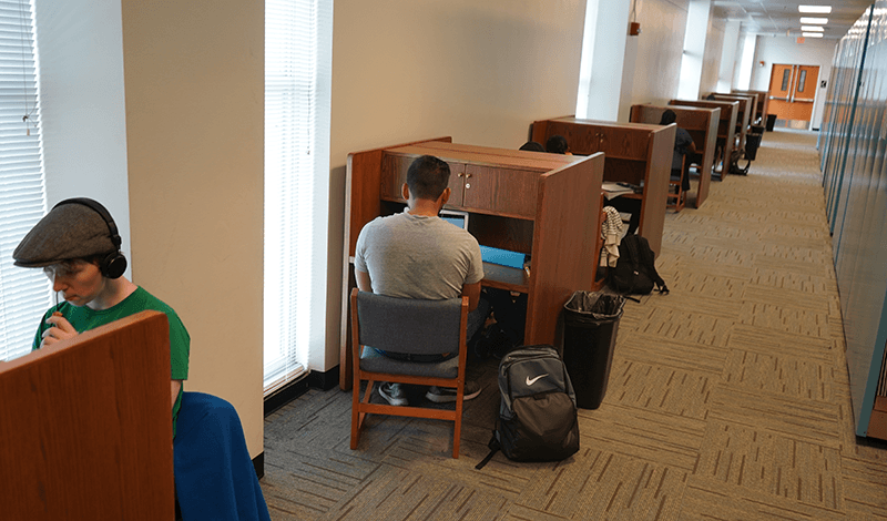 students studying in carrels