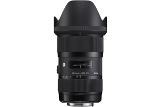 "Image of a Canon EF mount lens, featuring a cylindrical body with manual focus and zoom rings, as well as an aperture control ring. The lens is designed to attach to Canon EOS camera bodies and is commonly used for capturing high-quality images in various photographic scenarios."