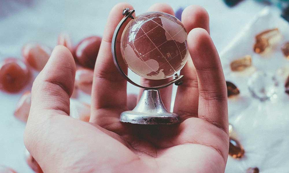 small globe held in hand