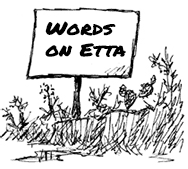 Words on Etta in a cartoon wood sign