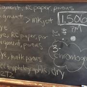 chalk board with various writings in white chalk