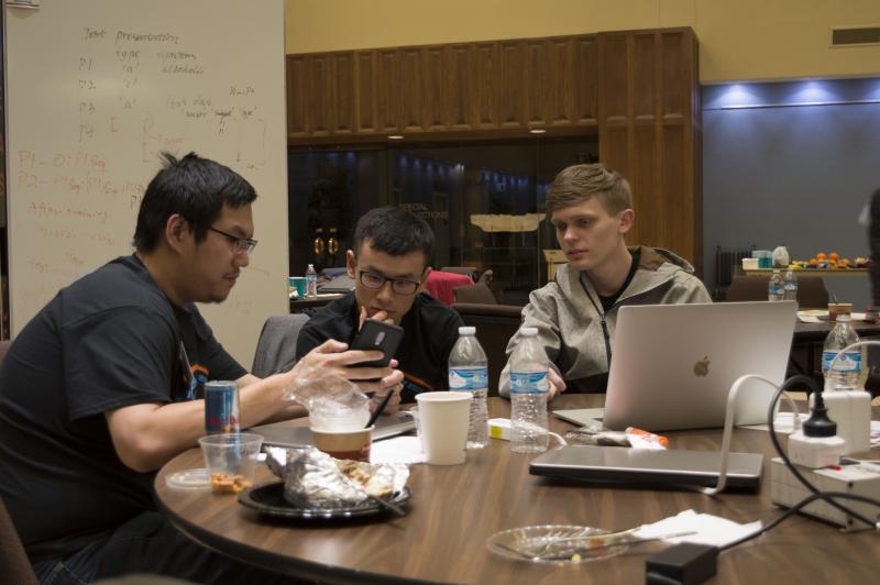 hackathon students working at table