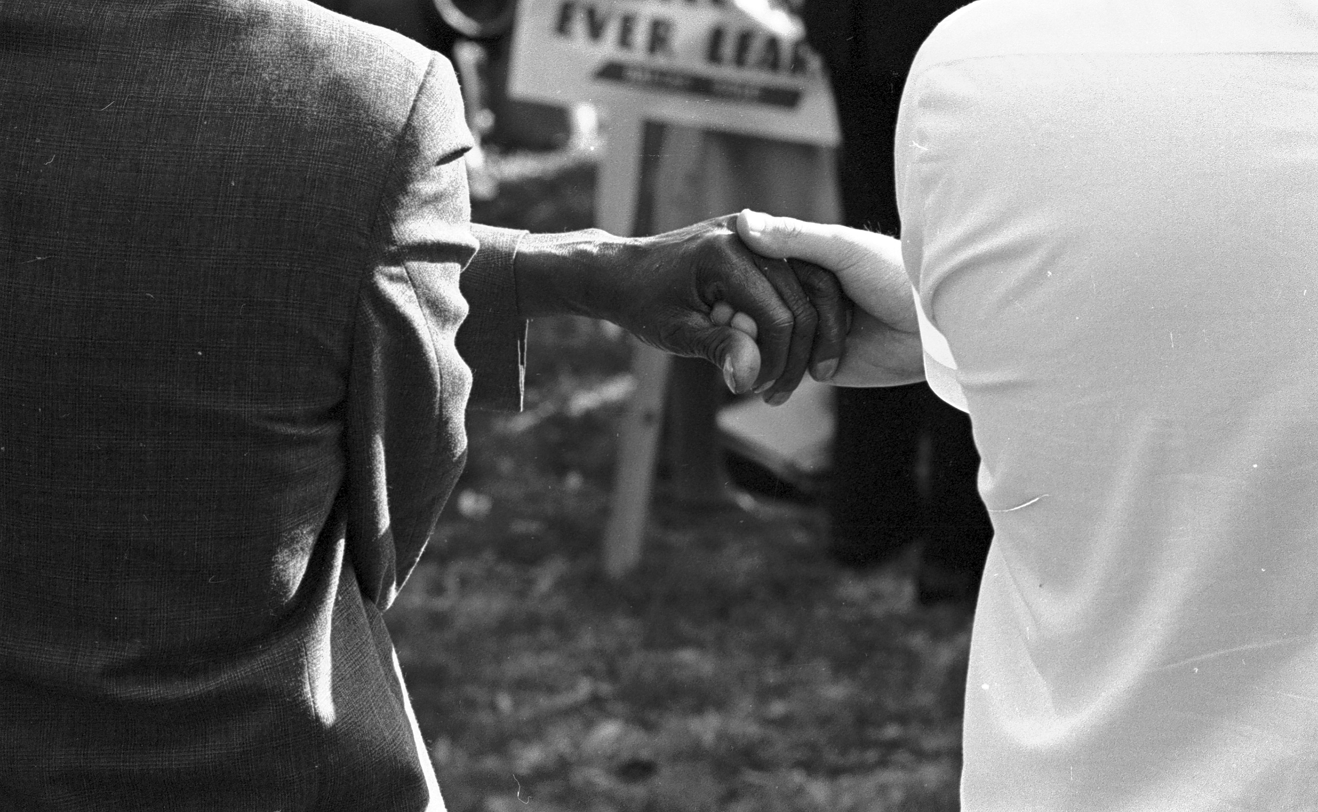 Two people holding hands during a Civil Rights demonstration held in Fort Worth, Texas, 03/14/1965.