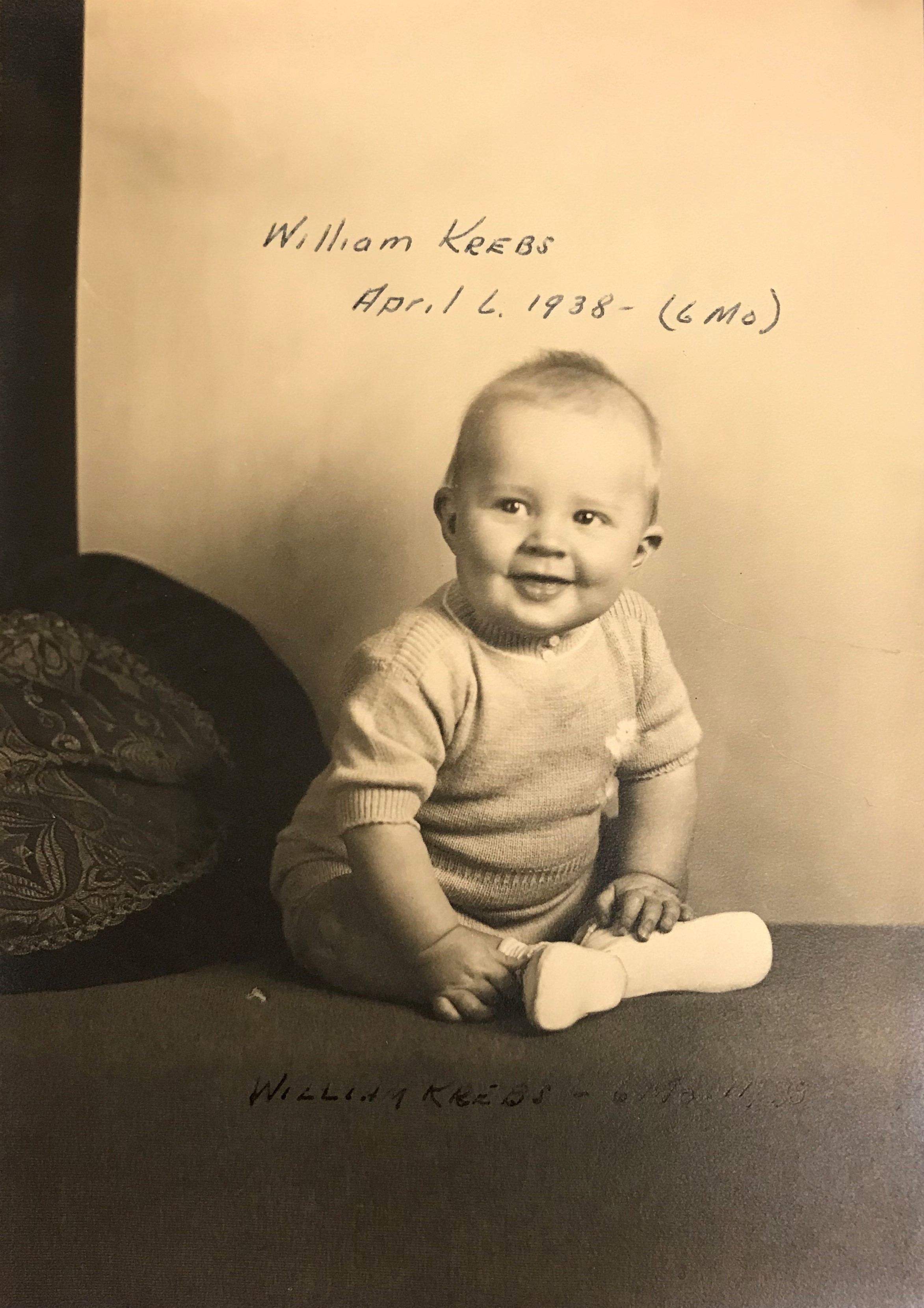 A baby poses for a photograph