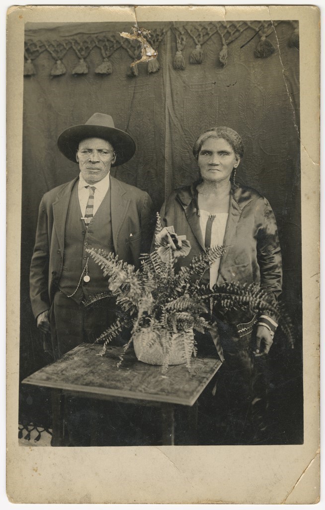 An African American man and woman pose for a formal photograph
