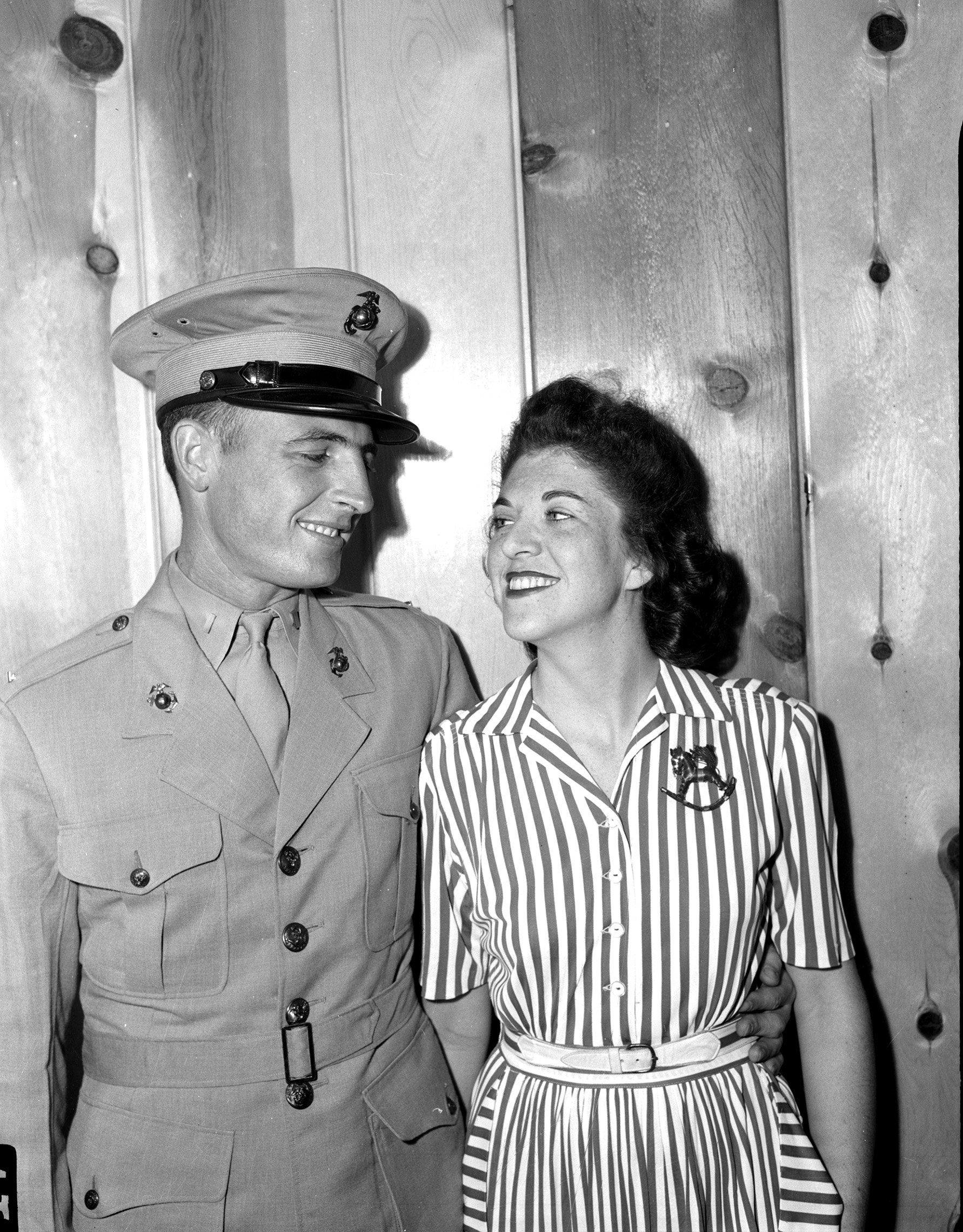 Lieutenant Robert G. Boydstun and his wife, Jeanne Mathis. He is wearing WWII Marine Corps uniform, and she is wearing a striped shirtdress with a rocking horse pin. 
