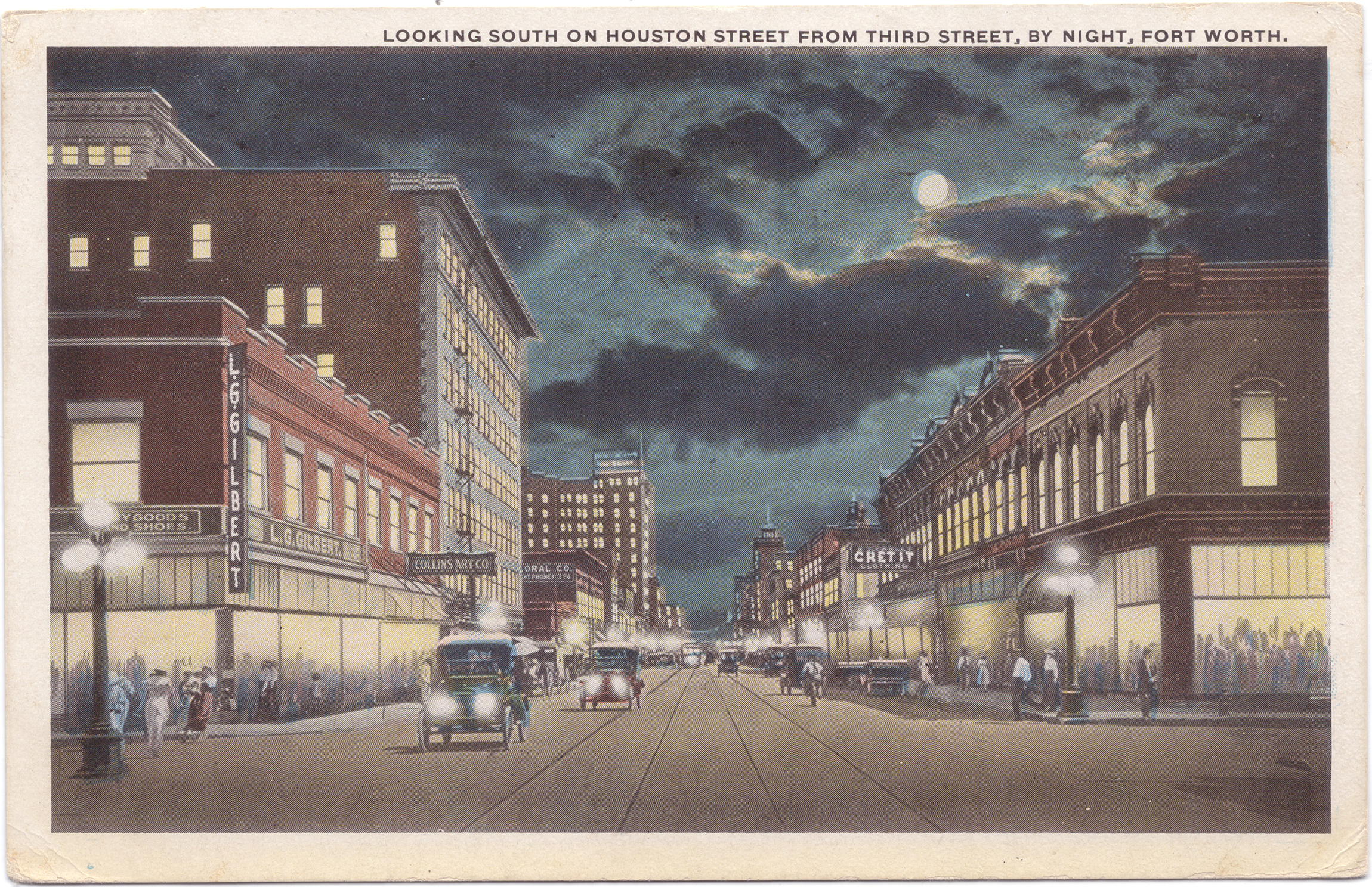 The postcard features a drawing of the street at night with cars in the middle of the street, people walking on the sidewalks, and buildings lining both sides.
