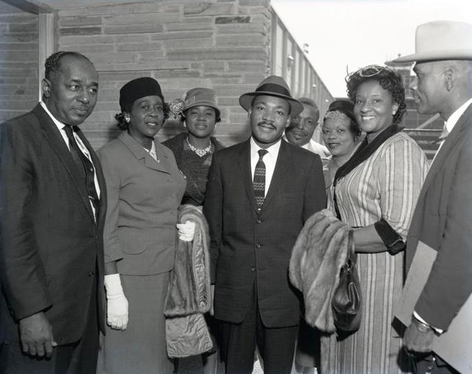 Dr. Martin Luther King greeting a group of people at Love Field Airport, Dallas, Texas; 10/22/1959.