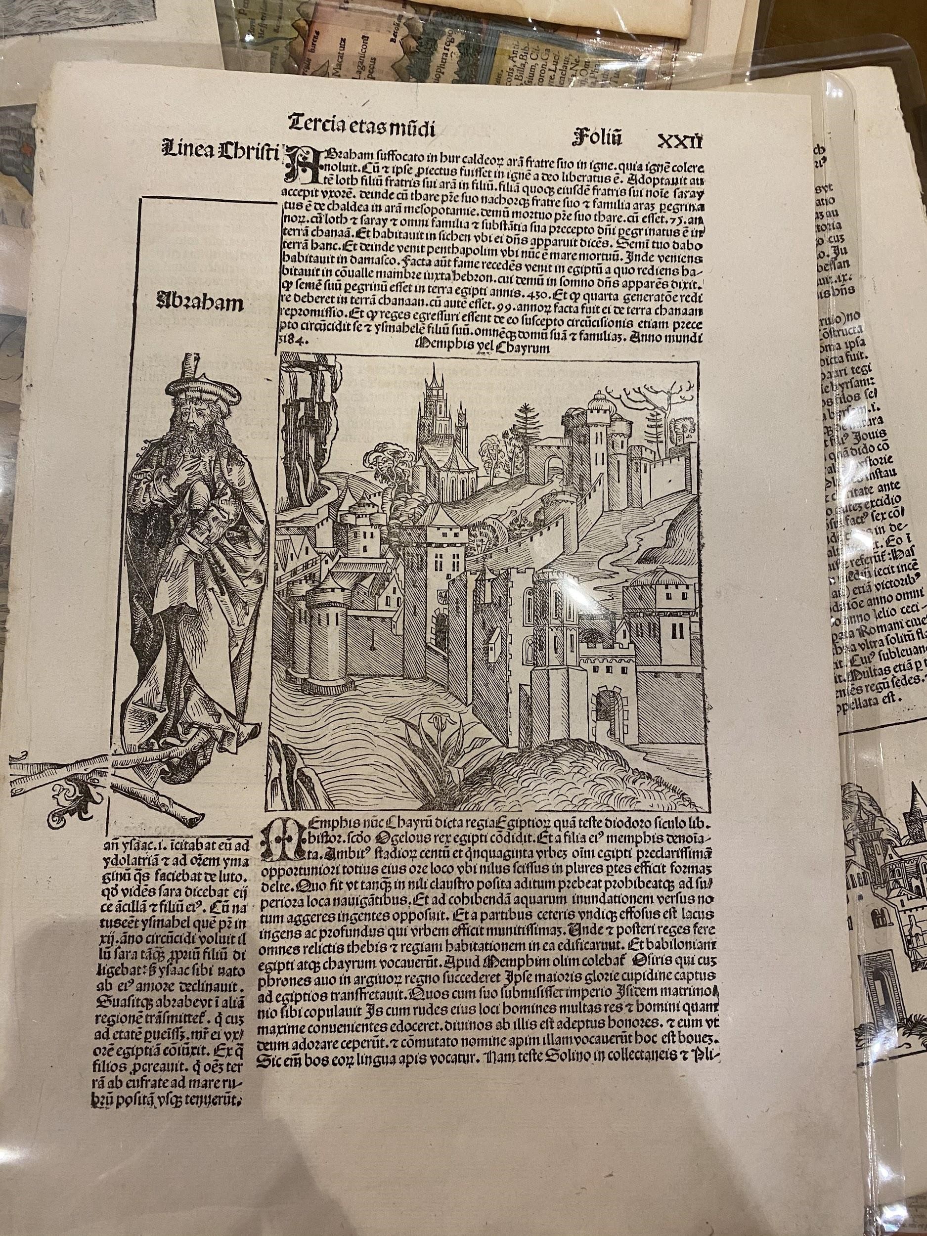 Black and white woodcut of a city and Abraham