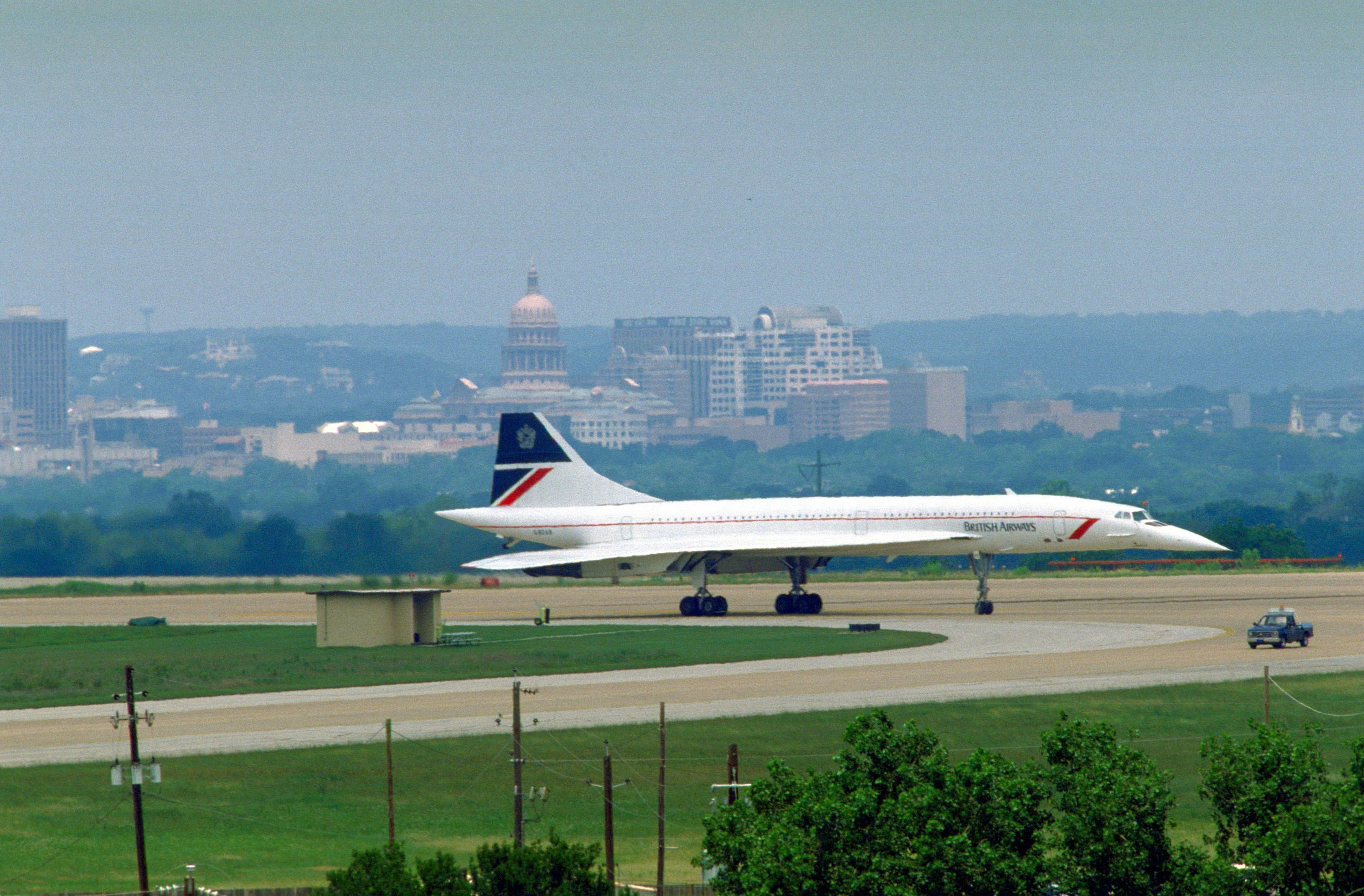A British Airways Concorde supersonic transport aircraft taxis to a stop upon arrival on base. The plane is carrying England's Queen Elizabeth II and her husband, Prince Philip, Duke of Edinburgh, who are arriving for a royal visit to the United States.