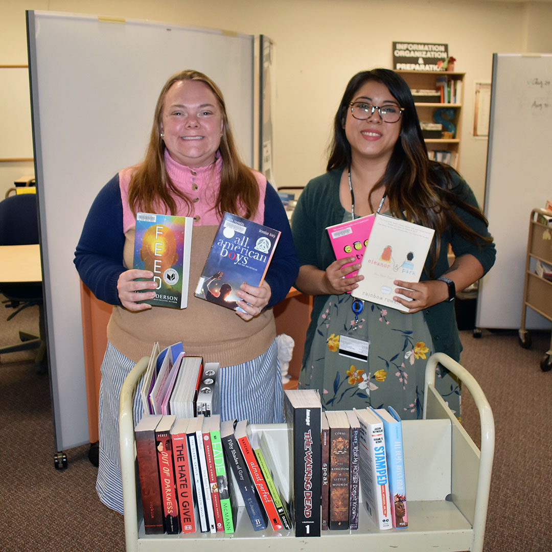 librarians showing covers of banned books