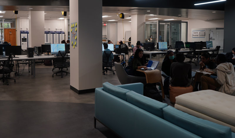 students studying in The Studios open area