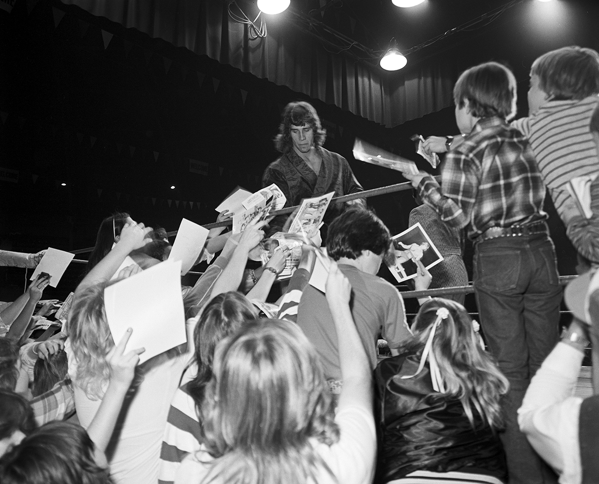 Wrestling at Will Rogers Coliseum, Fort Worth, Texas ca. 1981-82; Kerry Von Erich in the ring with fans surrounding the ring.