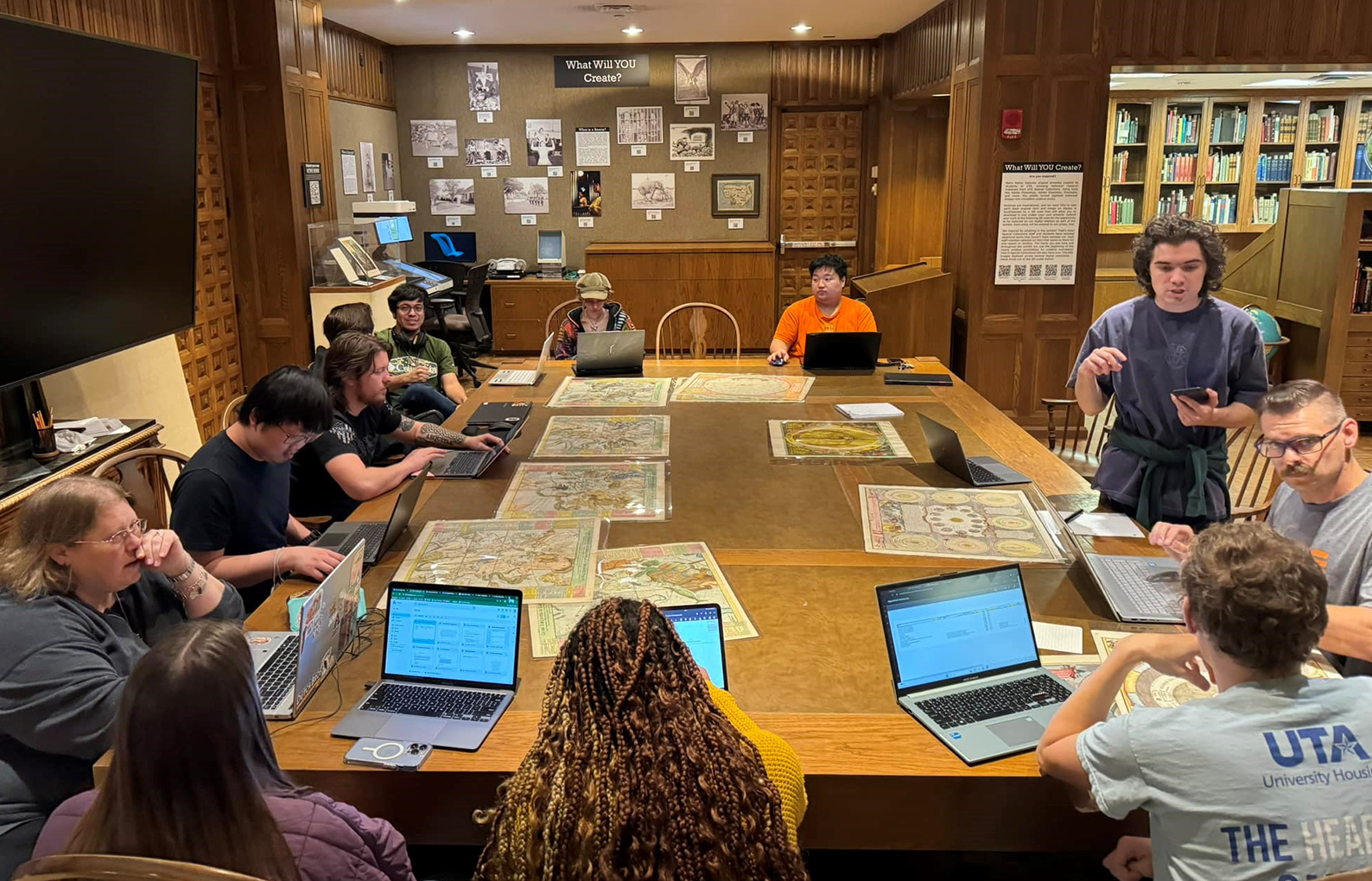 Color photo of a class studying in Special Collections.