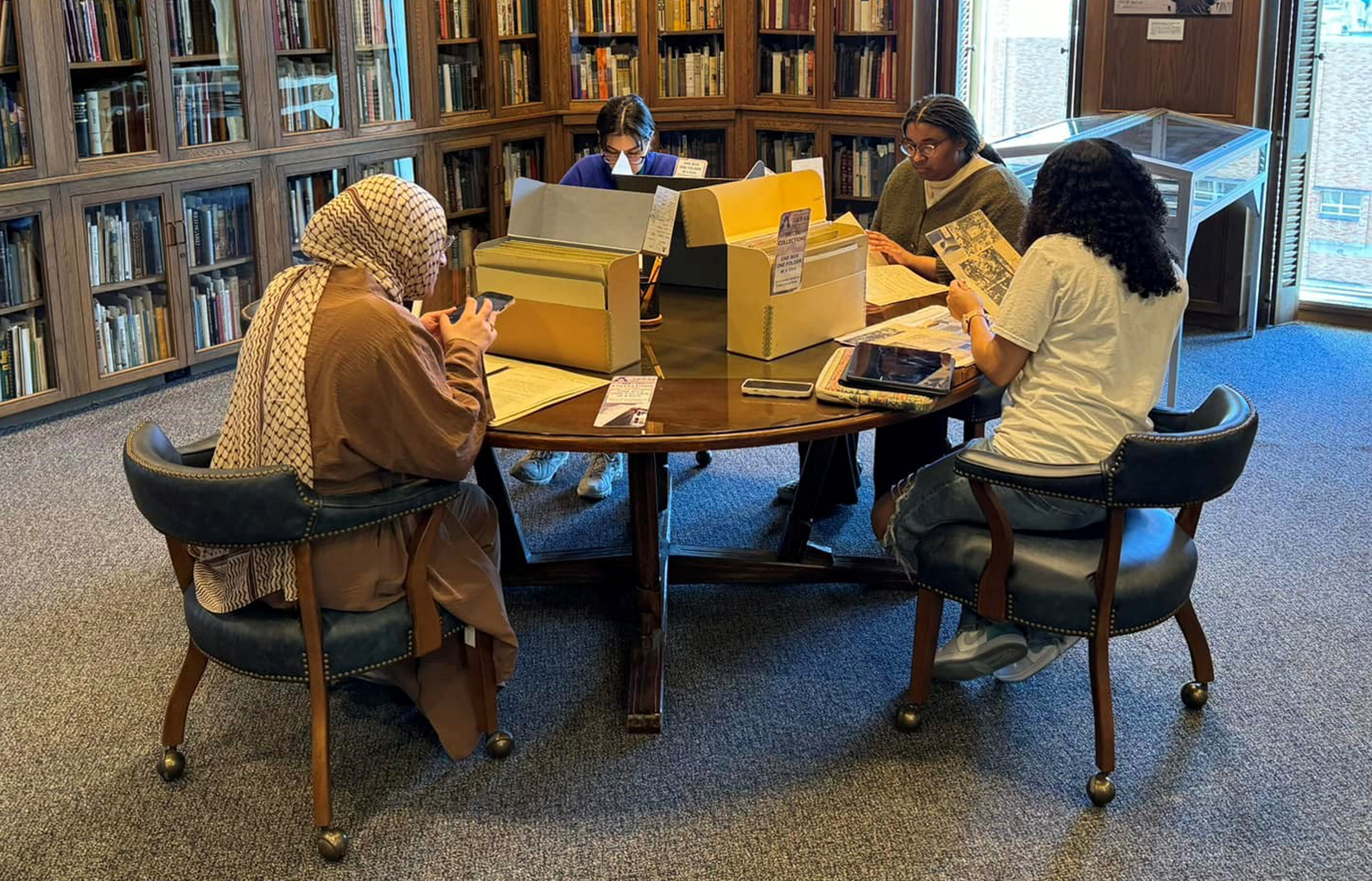 Color photo of a class studying in Special Collections.