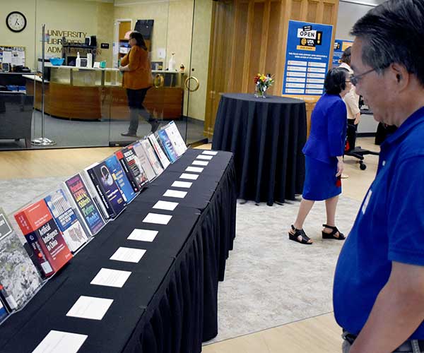 reception participant looking at books