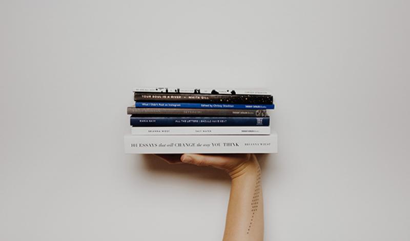 person holding books
