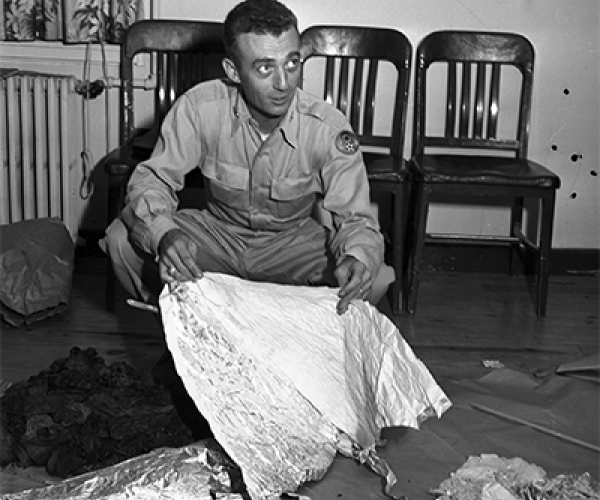 Major Jesse A. Marcel holding foil debris from Roswell, New Mexico UFO crash site, July 1947