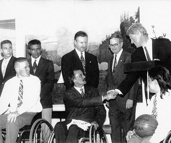 Jim Hayes shaking hands with President Bill Clinton