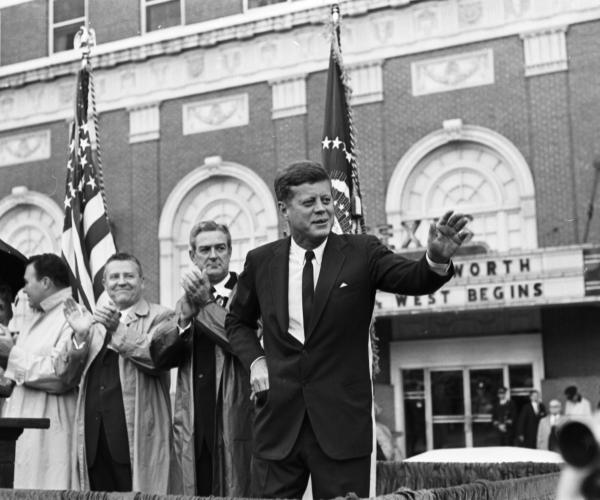 President John F. Kennedy greets crowd outside Hotel Texas; behind him is Mrs. and State Senator Don Kennard, Sen. Ralph Yarborough, Gov. John Connally