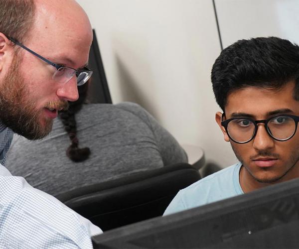 librarian consulting with student at computer