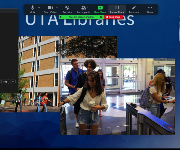 image of a zoom meeting, with screen shared to a powerpoint about the UTA libraries, chat is up, and the host is giving the "mav up" hand sign