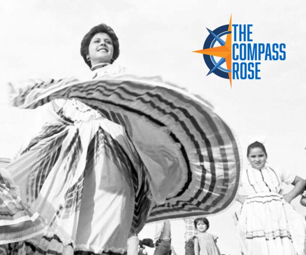 A ballet folklorico dancer twirls her skirt, a young girl stands in the background. The compass rose logo is at the top left corner.