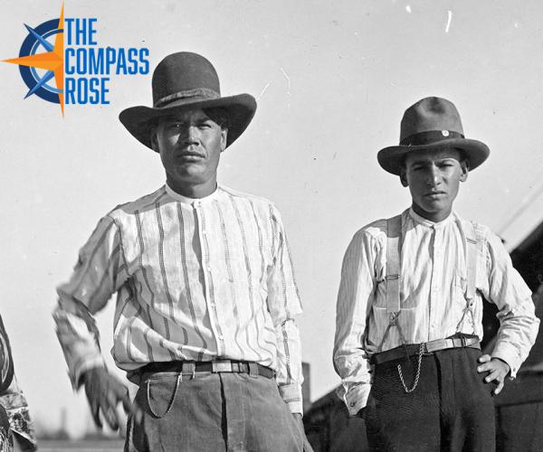 Cropped image with "The Compass Rose" logo. Crop of the two men in this image: A Mexican woman and two Mexican men, photographed in Breckenridge, Texas, 1920. The three are standing, the woman to the farthest left, and the two men next to her, both wearing hats.