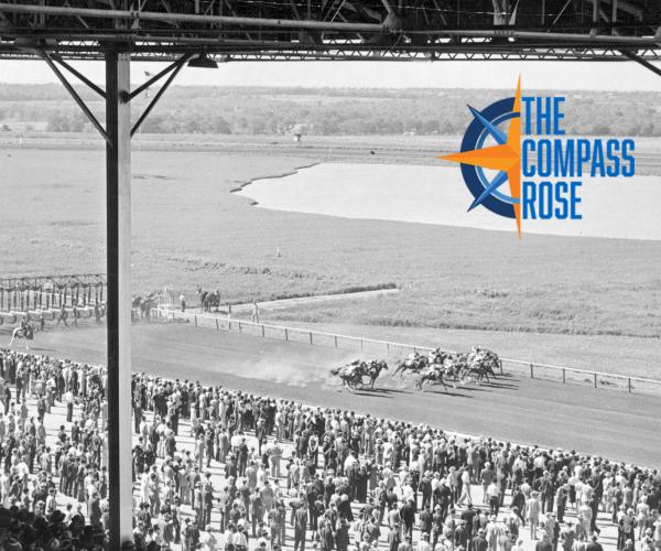 The racetrack surrounded by the crowds, with the Compass Rose logo
