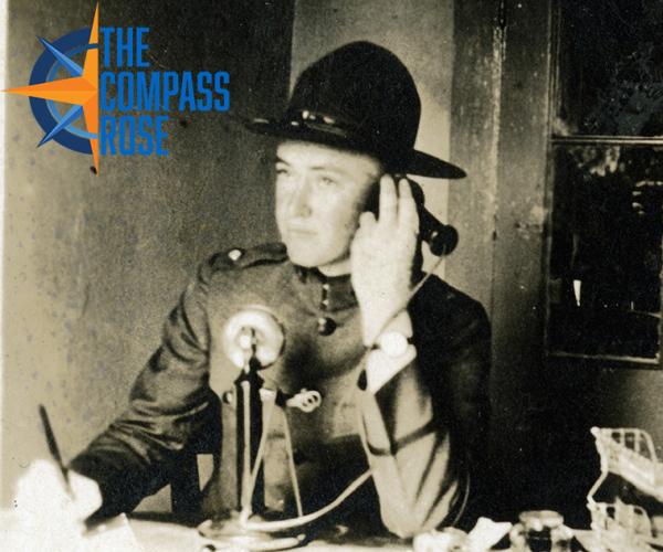 James Terrill using telephone, approximately 1910s. Compass Rose Logo at top right.