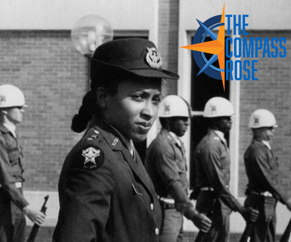 A female cadet in uniform and hat looks at the camera, with a row of cadets wearing uniforms and helments in the background. The Compass Rose logo is in the top right corner.