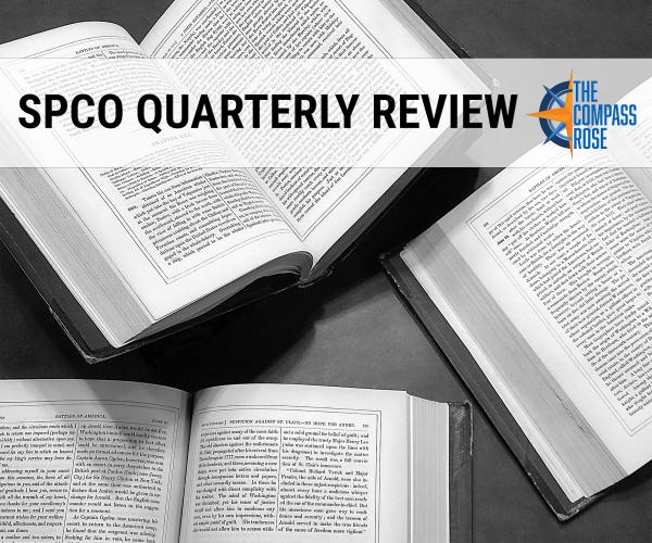 Black and white photograph of three open books spread out on a table with a banner of text across the top reading "SPCO Quarterly Review" with the orange and blue Compass Rose logo to the right of the banner text.