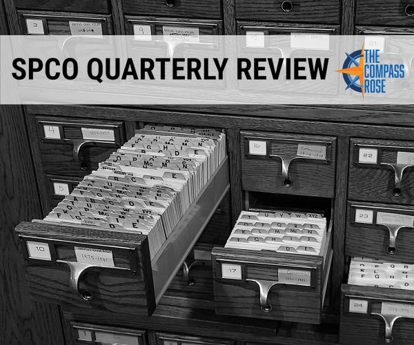 Black and white photograph of an open drawer of a card catalog with various letters in alphabetical and date order. The header text overlaid over the image reads "SPCO Quarterly Review" and there is a blue and orange Compass Rose logo to the right of the text.