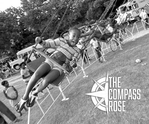 Juneteenth celebration with a young girl on a swing ride.