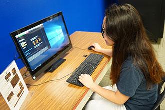 student sitting at computer accessing Bloomberg Terminal