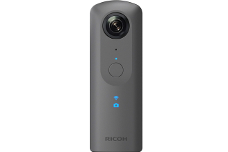 "Image of a Ricoh Theta V - 360 Camera, showcasing a compact, spherical design with dual fisheye lenses. The camera is designed for capturing immersive 360-degree photos and videos. It features a sleek finish and minimalistic controls, ideal for users interested in virtual reality content creation and immersive storytelling."